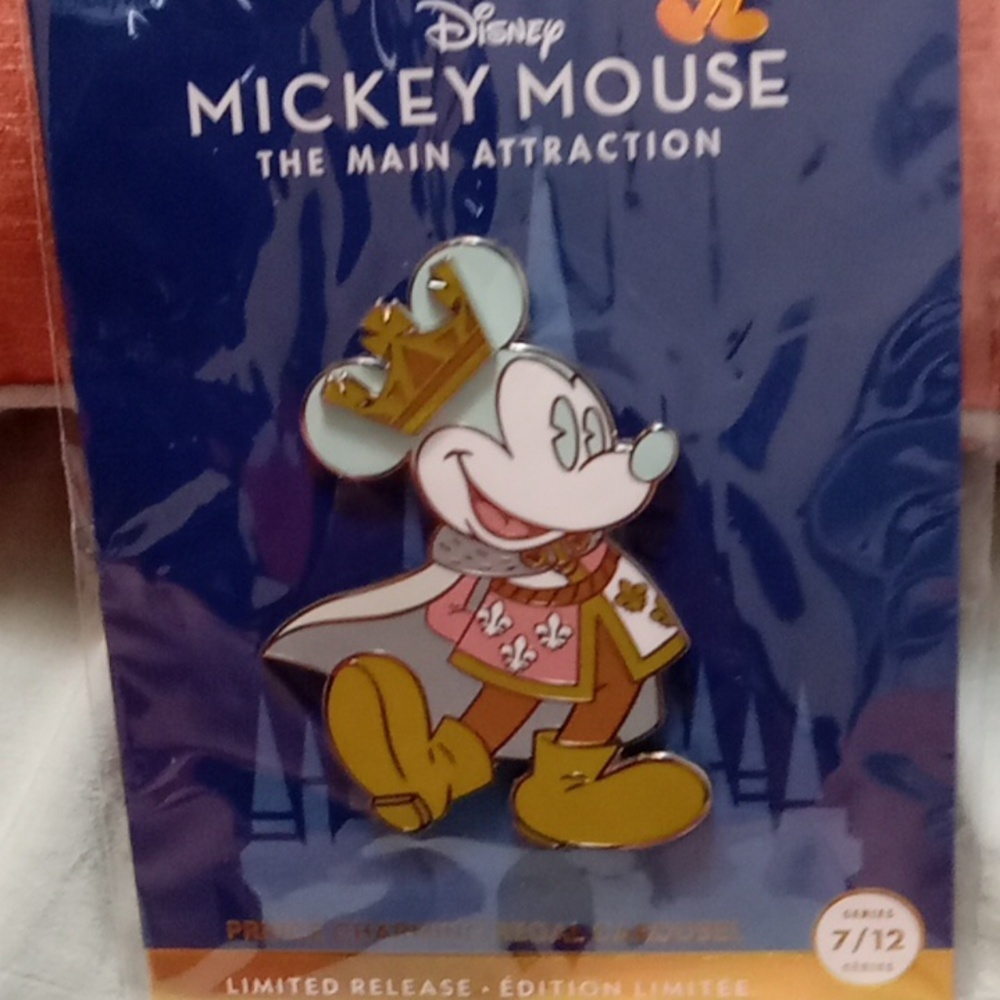 Mickey Mouse pin.